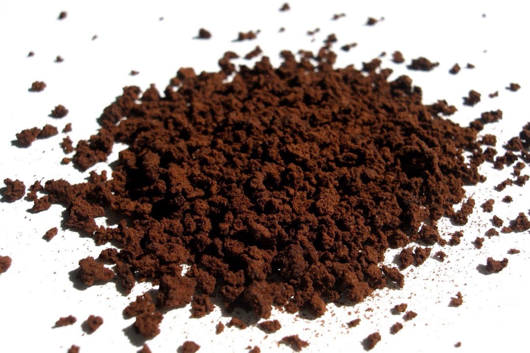 Freeze-dried instant coffee granules on a white surface