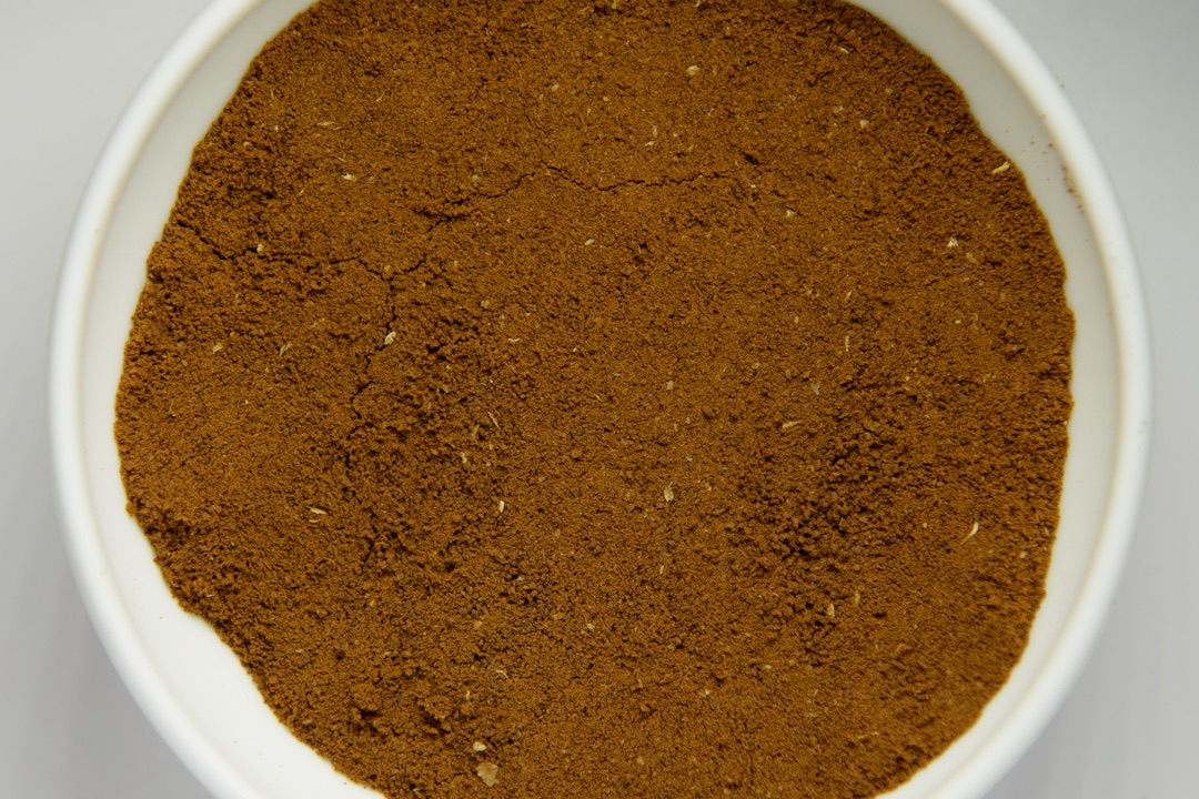 Finely ground espresso powder in a white bowl